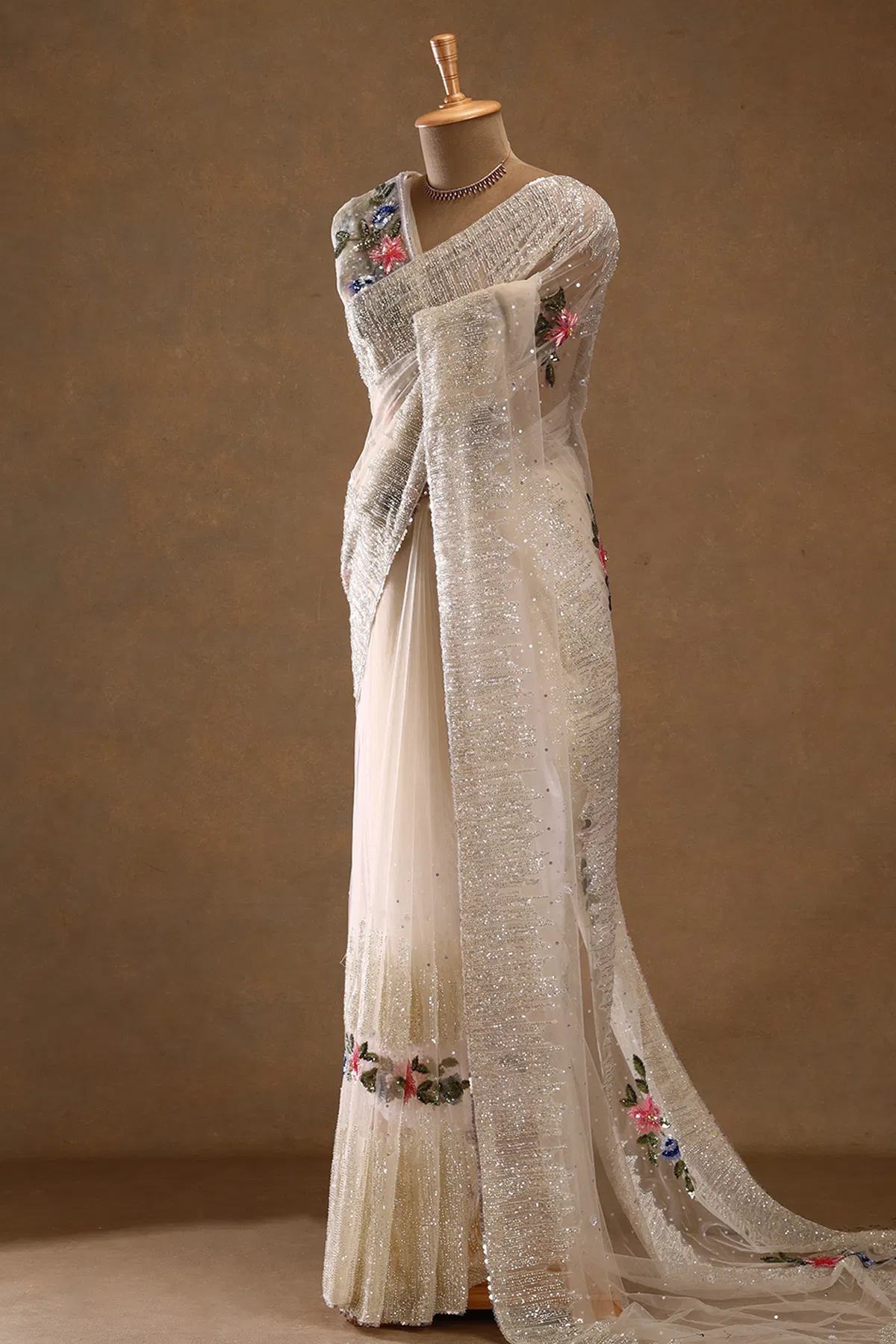 Off white cutdana embroidered net designer saree
